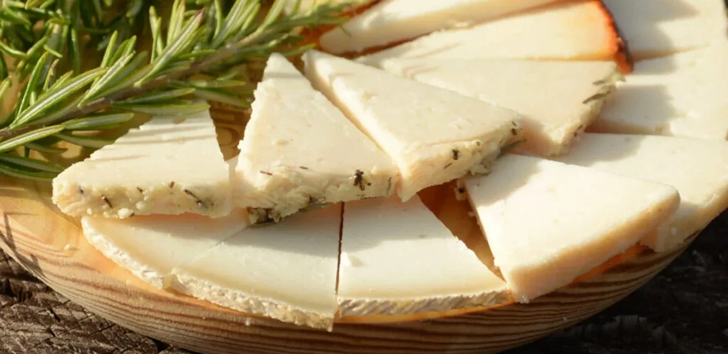 A table with payoyo cheese and rosemary
